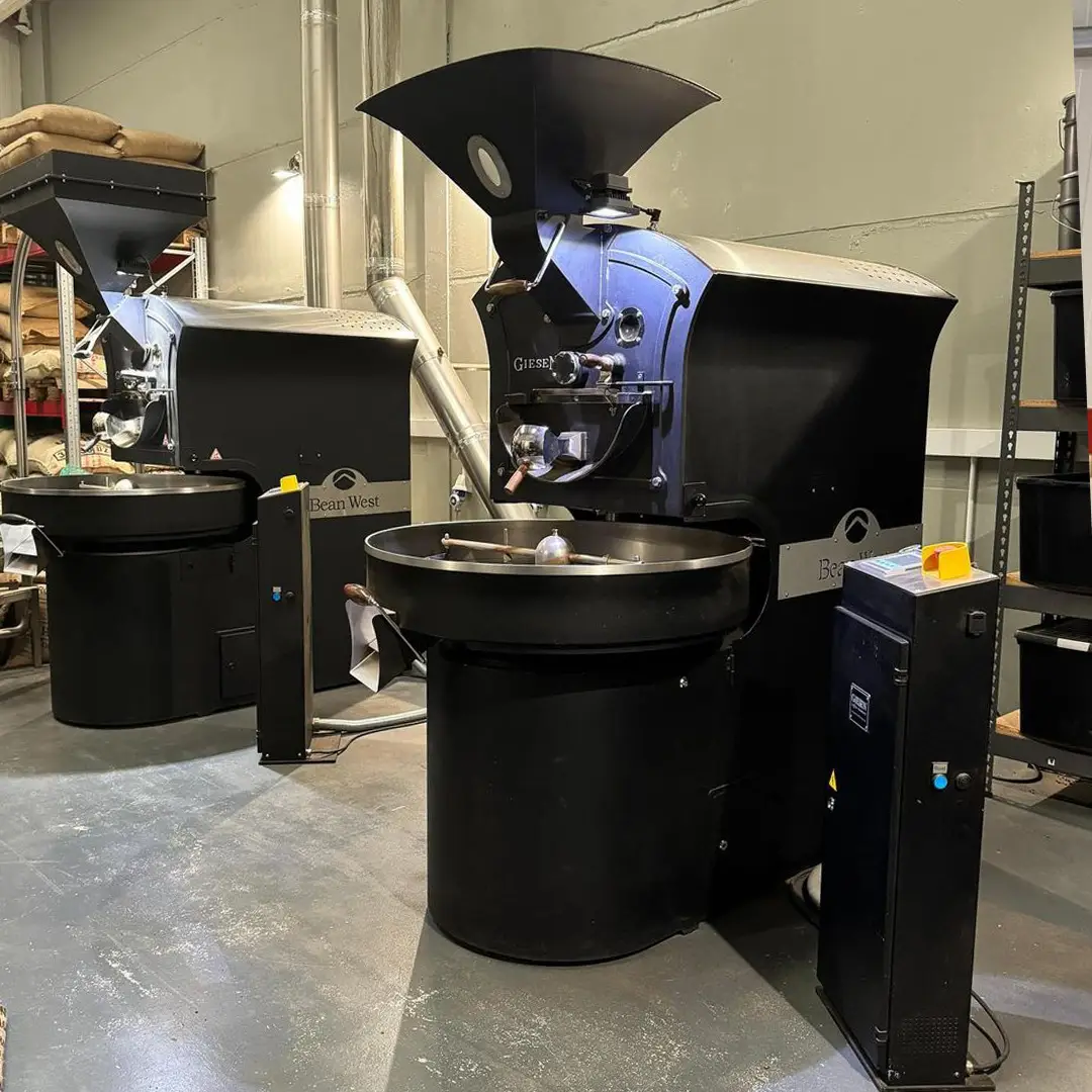 Two Giesen roasters of different sizes in a working roastery