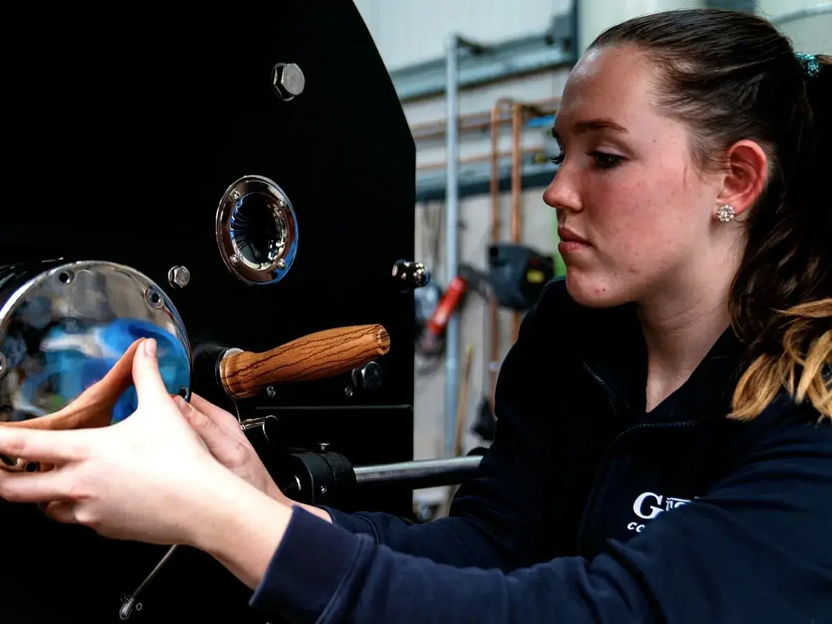 Engineer inspecting the door of a Giesen coffee roaster