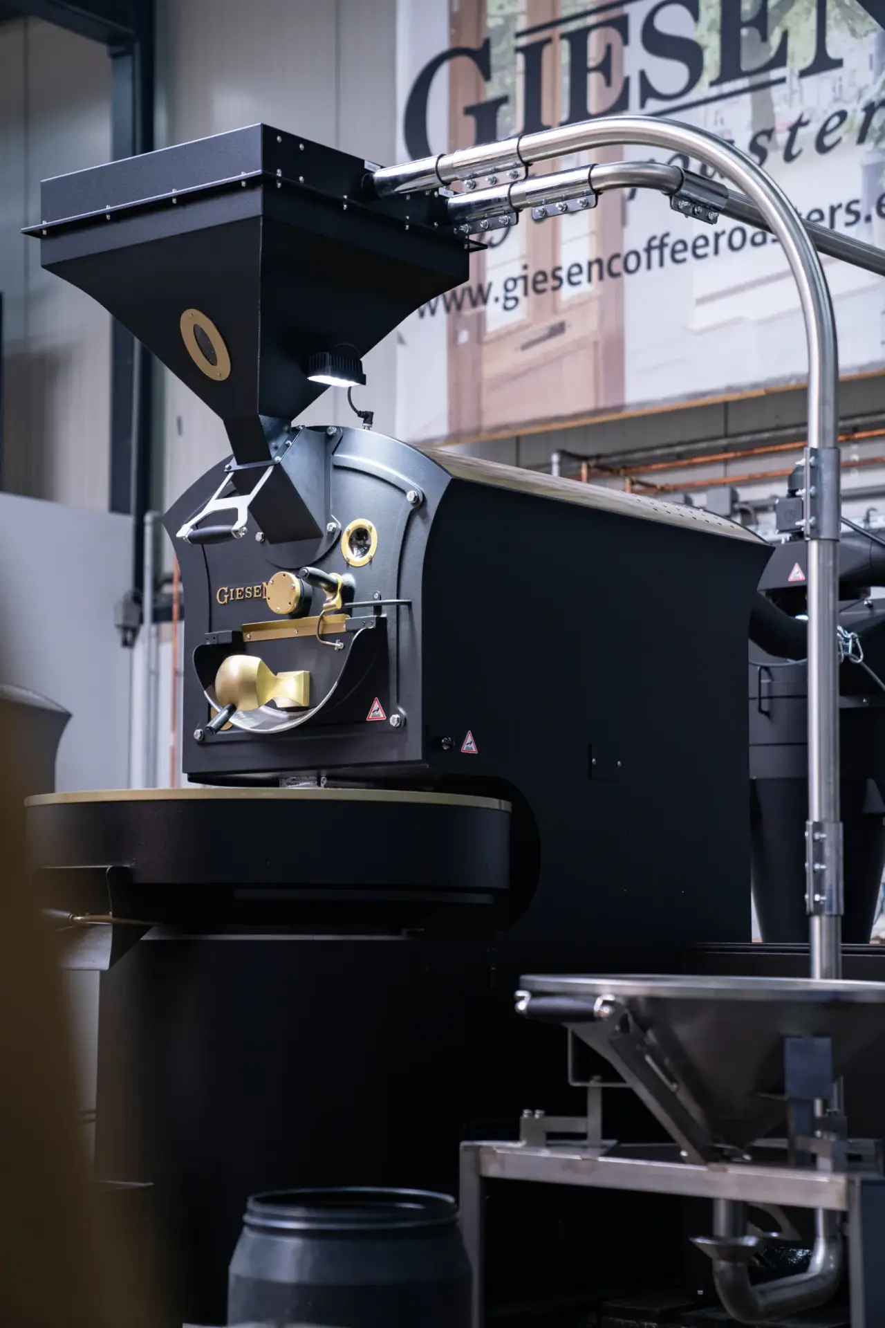 Commercial coffee roaster on a showroom floor